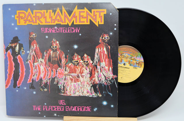 Front cover of Parliament Funkentelechy Vs. The Placebo Syndrome vinyl LP showing band in colorful costumes and bold title artwork
