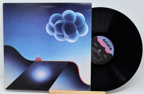 Vinyl record with a unique cover featuring abstract designs and the Arista label.