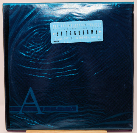 Vinyl record with 'Arista' and 'Stereotomy' branding on a textured blue surface.