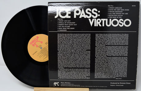 Vinyl record with 'Joe Pass: Virtuoso' album cover on a white background