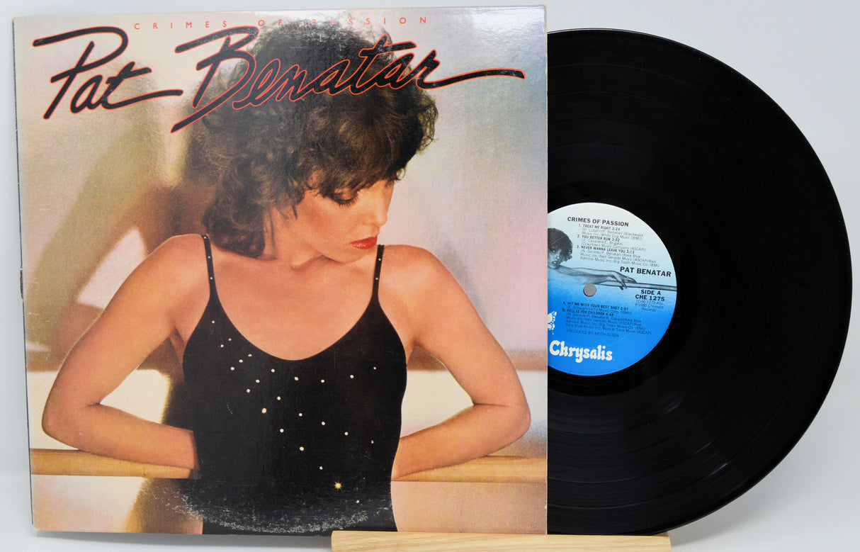 Vinyl record with cover featuring a woman, on a white background