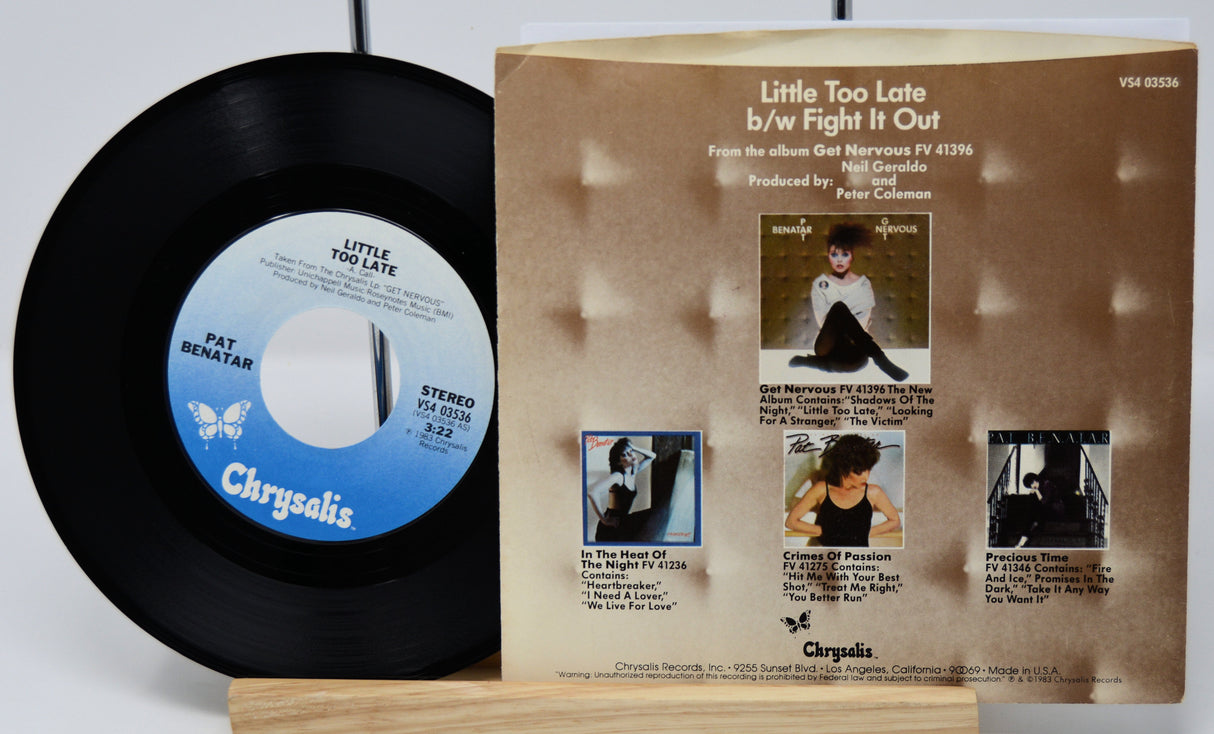 Vinyl record and its cover with 'Chrysalis' branding on a white background