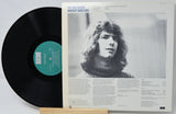 Vinyl record with a portrait on the cover and text details