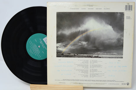 Vinyl record with a rainbow cover on a white background