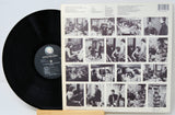 Vinyl record with a black label and a cover featuring black and white photos of people.