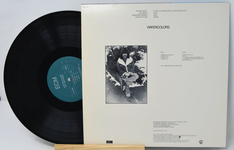 Vinyl record with cover displaying 'ECM' label and black and white photo of a person.