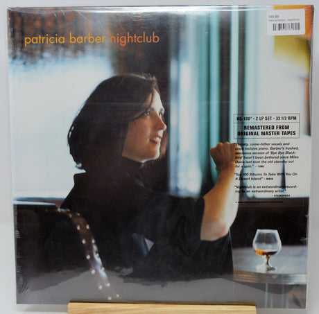 Patricia Barber - Nightclub vinyl record LP set in its shrink wrap, displayed on a small wooden stand against a white background.