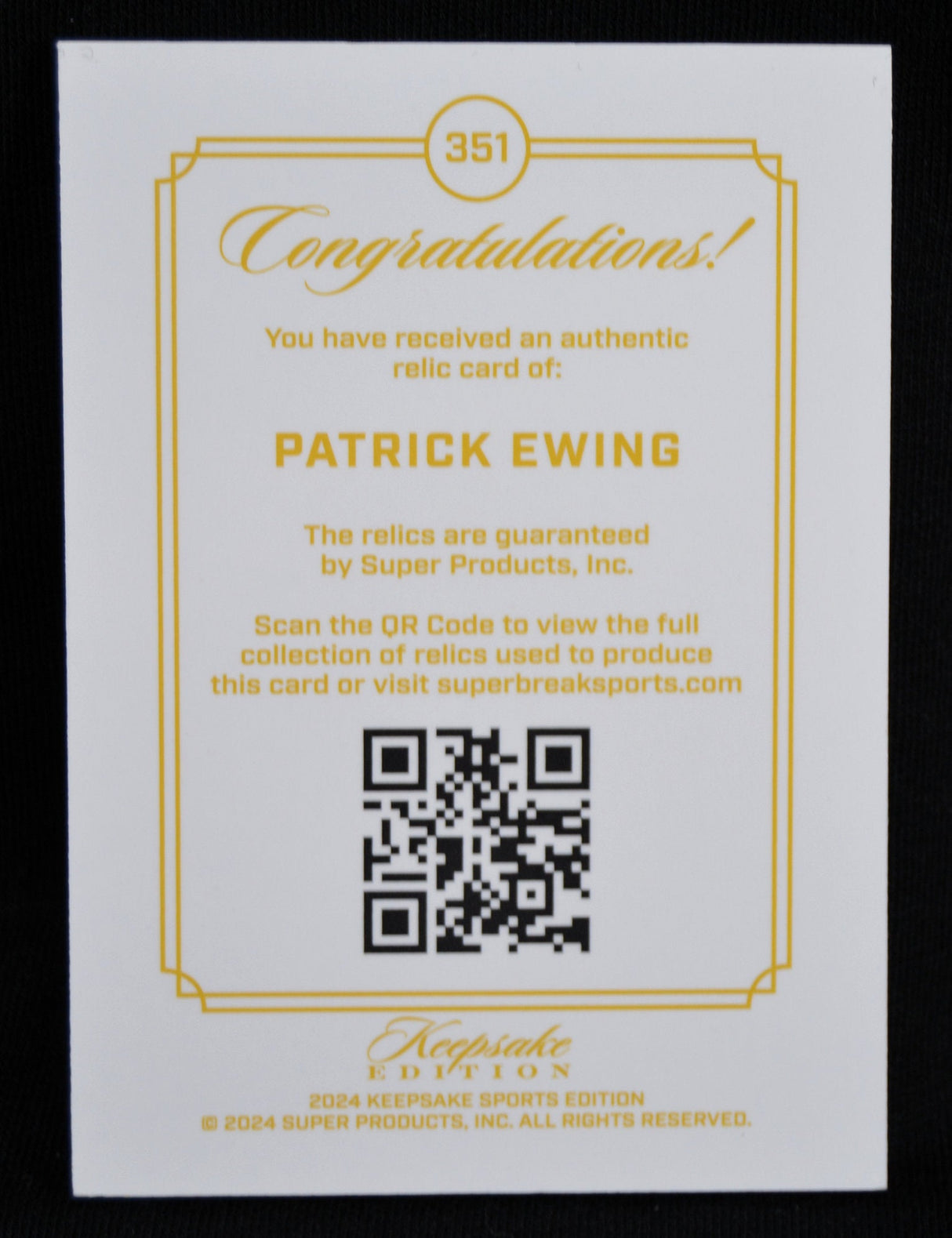 Certificate of authenticity for Patrick Ewing relic card with QR code and gold border