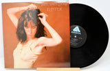 Used vinyl record of Patti Smith - Easter with the album cover and vinyl record visible.