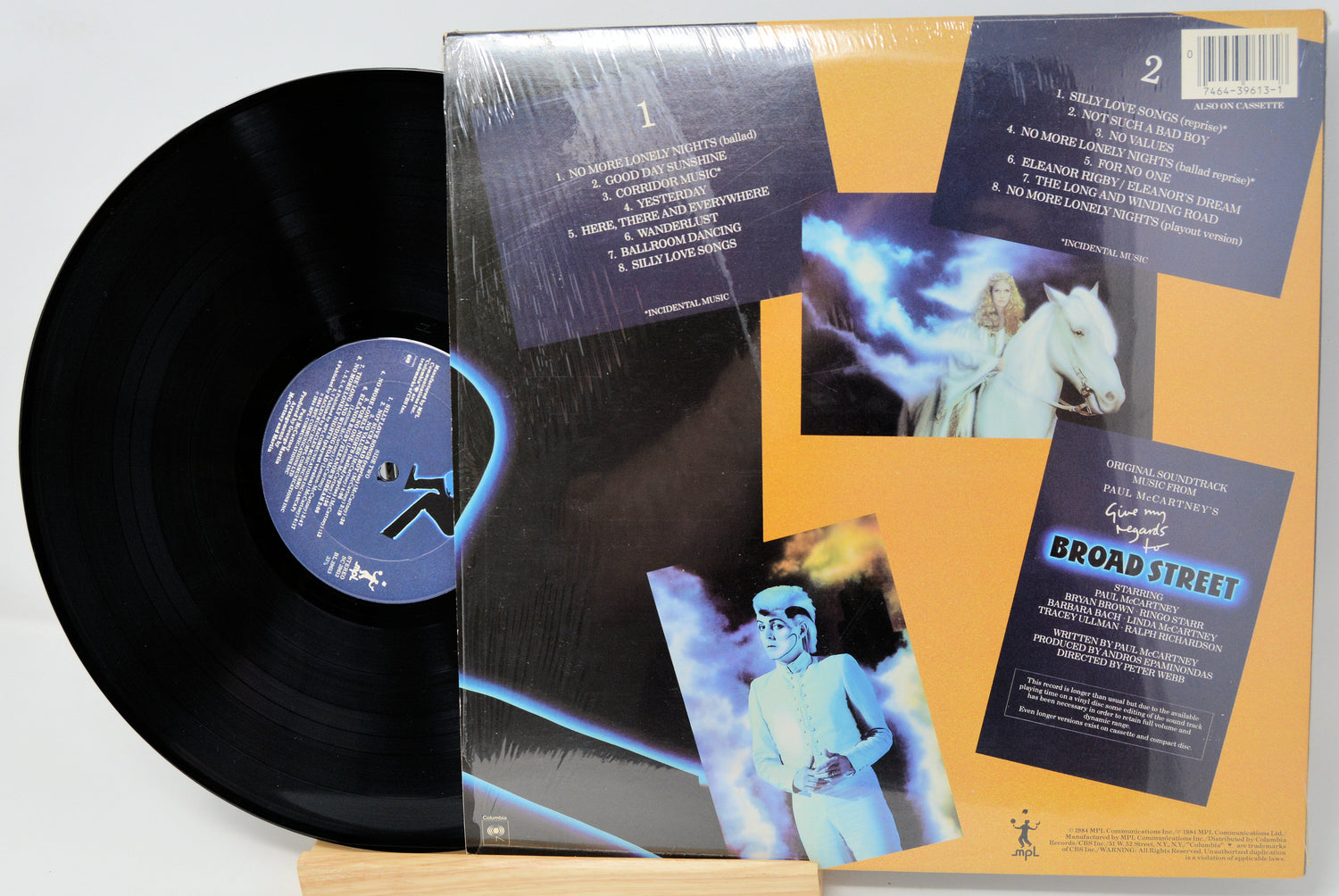 Vinyl record with cover featuring images and text