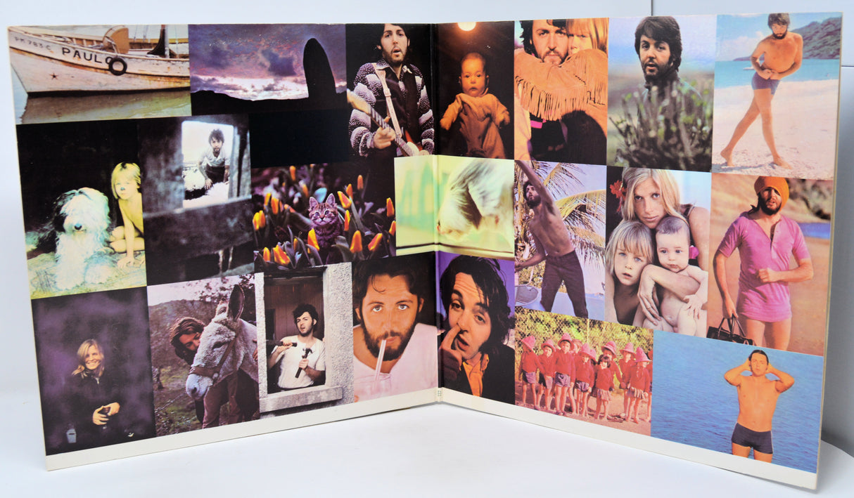 Collage of various images on a album cover with a white background
