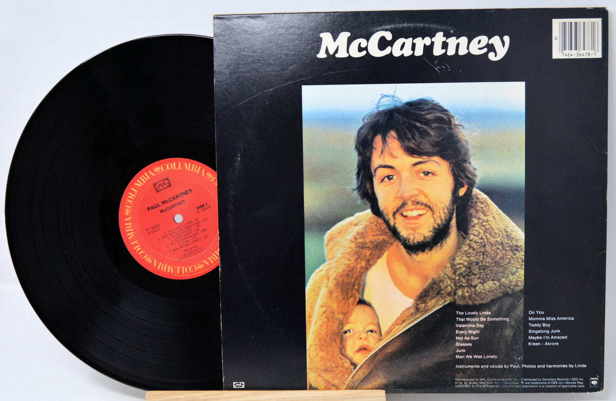 Vinyl record with cover featuring a man holding a child, titled 'McCartney'.