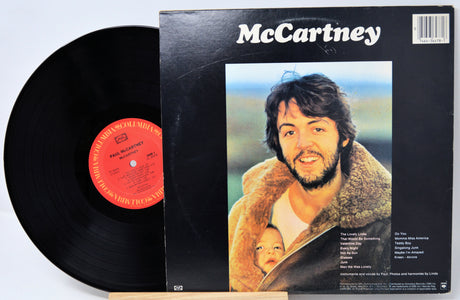 Vinyl record with cover featuring a man holding a child, titled 'McCartney'.