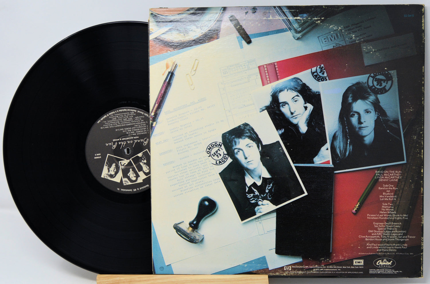 Vinyl record with a colorful cover featuring black and white photos of a couple.