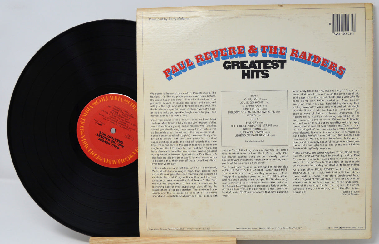 Vinyl record with 'Paul Revere & The Raiders Greatest Hits' cover on a white background