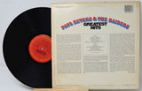 Vinyl record with 'Paul Revere & The Raiders Greatest Hits' cover on a white background