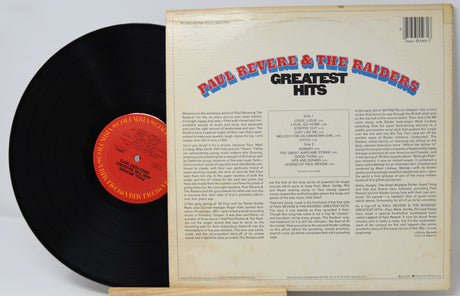 Vinyl record with 'Paul Revere & The Raiders Greatest Hits' cover on a white background