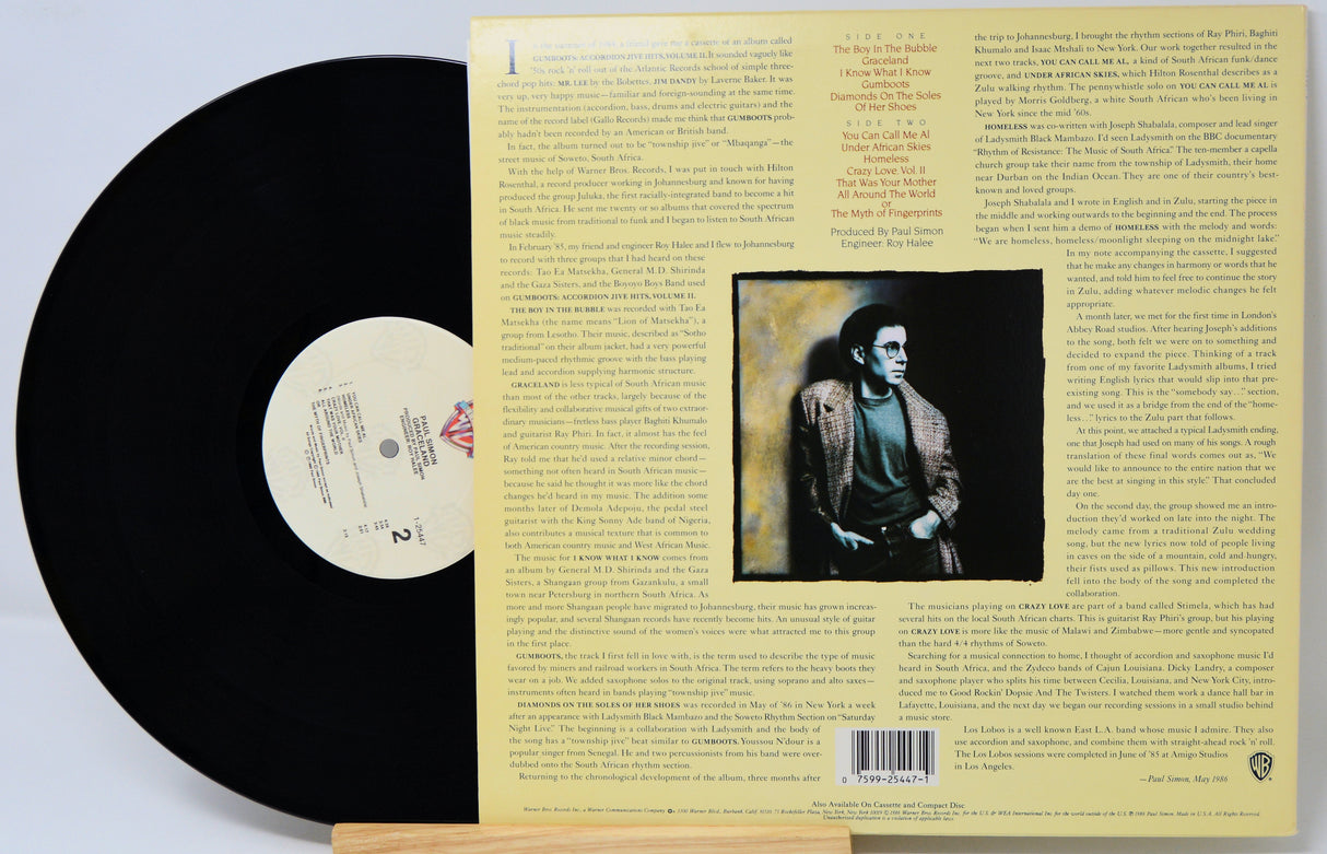 Vinyl record with cover featuring a black and white portrait and text