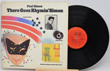 Vinyl record with cover featuring a colorful design and text