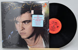 Vinyl record with cover featuring a portrait of Paul Young and text