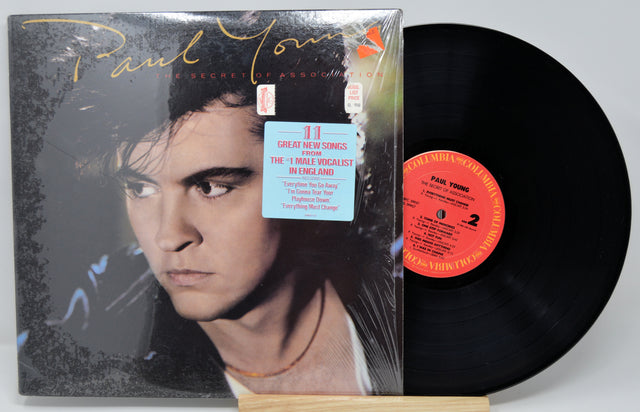 Vinyl record with cover featuring a portrait of Paul Young and text