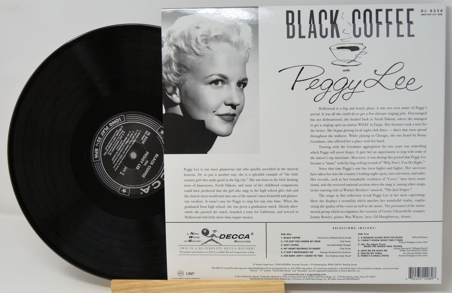 Peggy Lee 'Black Coffee' vinyl record album shown with the black record partially pulled from its printed outer sleeve, which features a portrait photo and track listing text.
