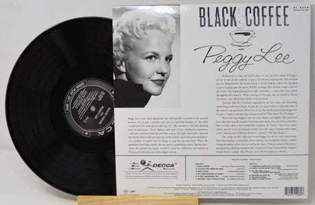 Peggy Lee 'Black Coffee' vinyl record album shown with the black record partially pulled from its printed outer sleeve, which features a portrait photo and track listing text.
