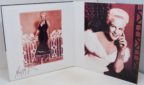 An open photo album or book showing two vintage portraits of a blonde woman. The left page has a sepia-toned portrait of her standing by a railing, with a signature at the bottom.