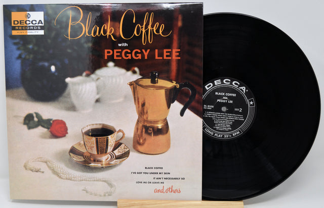Vinyl record album 'Black Coffee with Peggy Lee' on Decca, showing the printed cover in front of the black vinyl record on a stand.