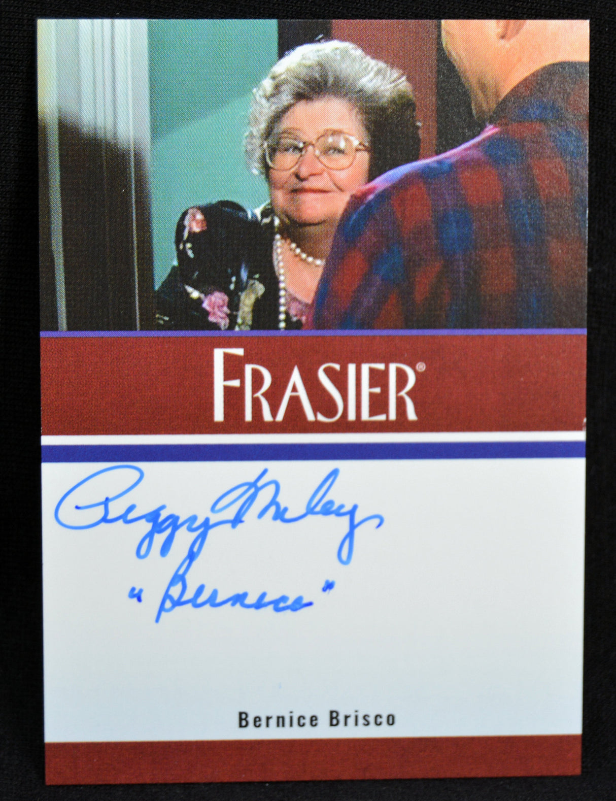 Trading card featuring Peggy Miley as Bernice Brisco from 'Frasier' with a signature and character name.