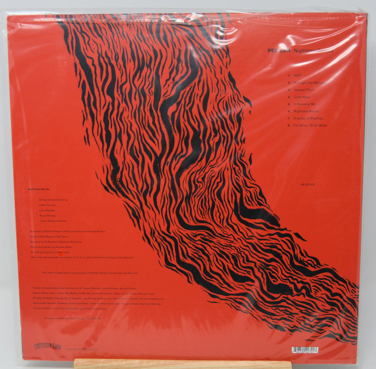 Back cover of Pelican Nighttime Stories vinyl LP featuring red and black abstract art and tracklist