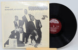 Vinyl record with cover featuring a group of people and penguins, labeled 'The Cool, Cool Penguins'.