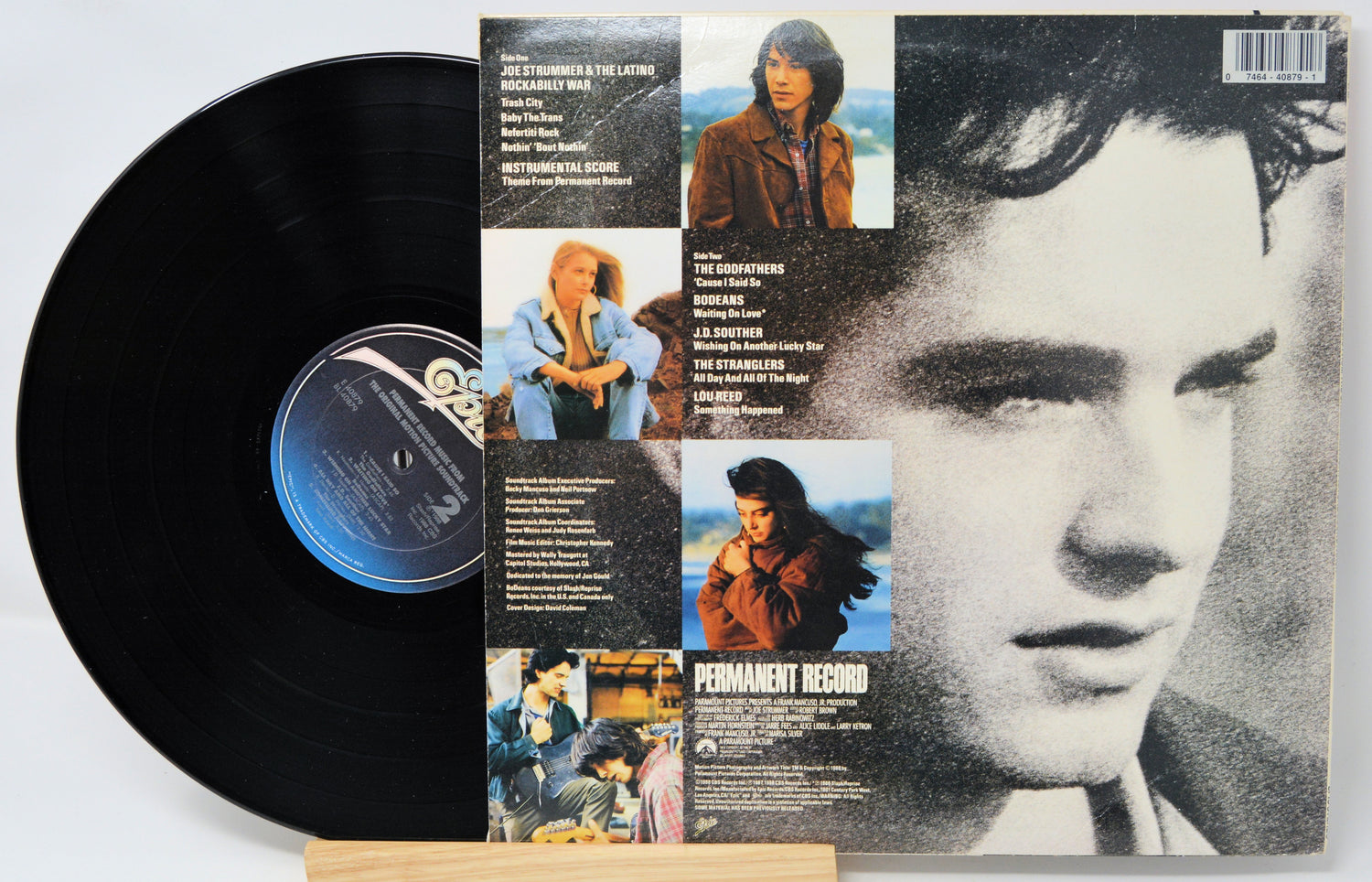 Vinyl record with a cover featuring a collage of images and text