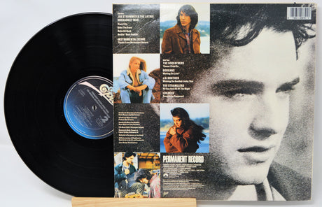 Vinyl record with a cover featuring a collage of images and text
