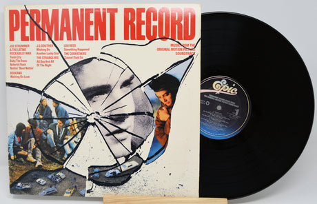 Vinyl record with a 'Permanent Record' album cover featuring a broken umbrella and people.
