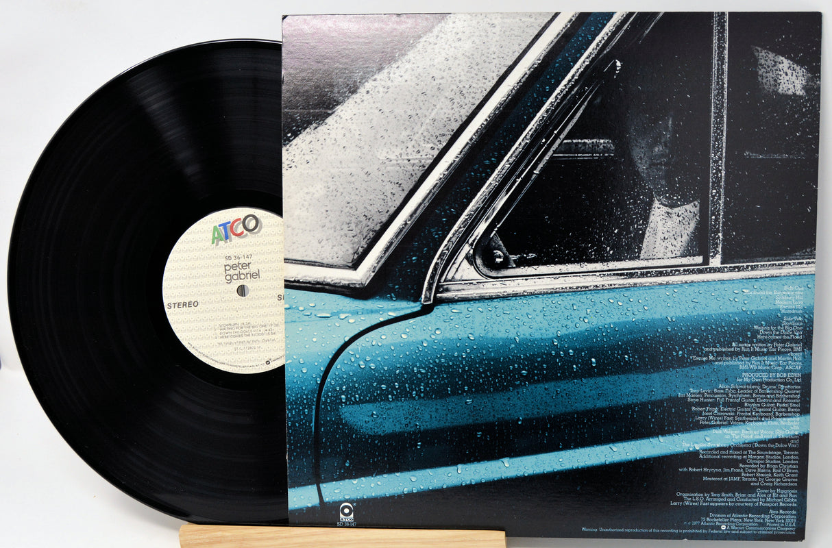 Vinyl record with a car-themed cover on a white background