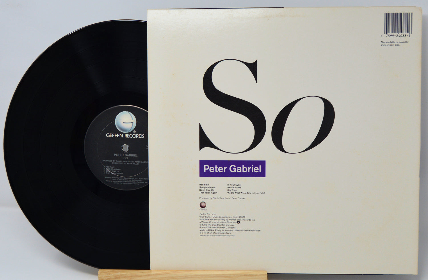 Vinyl record with cover displaying 'Peter Gabriel' on a light gray background
