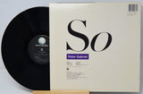 Vinyl record with cover displaying 'Peter Gabriel' on a light gray background