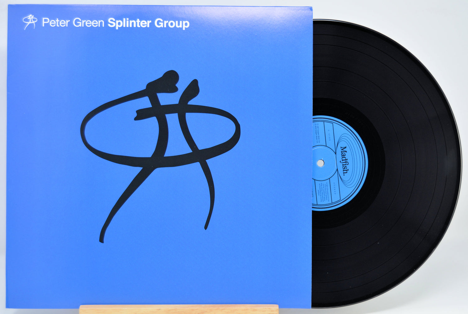 Peter Green Splinter Group vinyl record with blue cover art and a black LP partially pulled out, photographed against a light gray background.