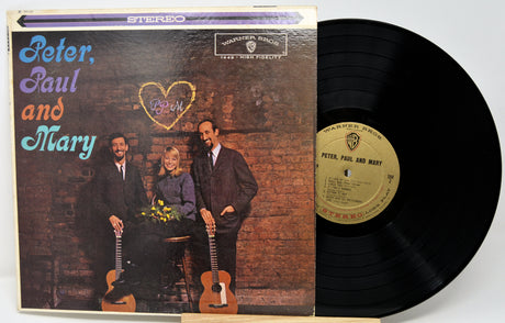 Vinyl record with cover featuring 'Peter, Paul and Mary' on a white background