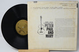 Vinyl record with cover featuring 'Peter, Paul and Mary' on a light gray background
