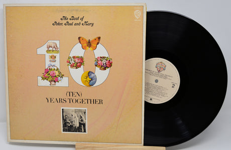 Vinyl record and cover titled 'The Best of Peter, Paul and Mary Ten Years Together' on a white background