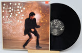 Vinyl record with cover featuring a person and album title 'Peter Wolfe'.