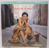 Madeleine Peyroux 'Careless Love' original master recording vinyl LP cover, sealed in its plastic shrink wrap, displayed on a wooden stand against a light gray background.