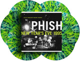 Six splatter colored records (Green, yellow, blue and white) and the front cover for the Phish 'Live At Madison Square Garden, New Year's Eve 1995' vinyl box set.