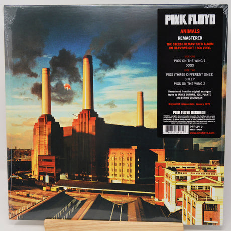 Back cover of a Pink Floyd 'Animals' 12-inch vinyl record, showing the printed artwork of Battersea Power Station with a black tracklist panel on the right.