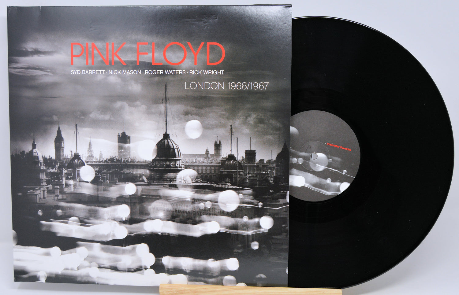 Pink Floyd 'London 1966/1967' vinyl record album with the black LP partially pulled from the cover, photographed on a light gray background.