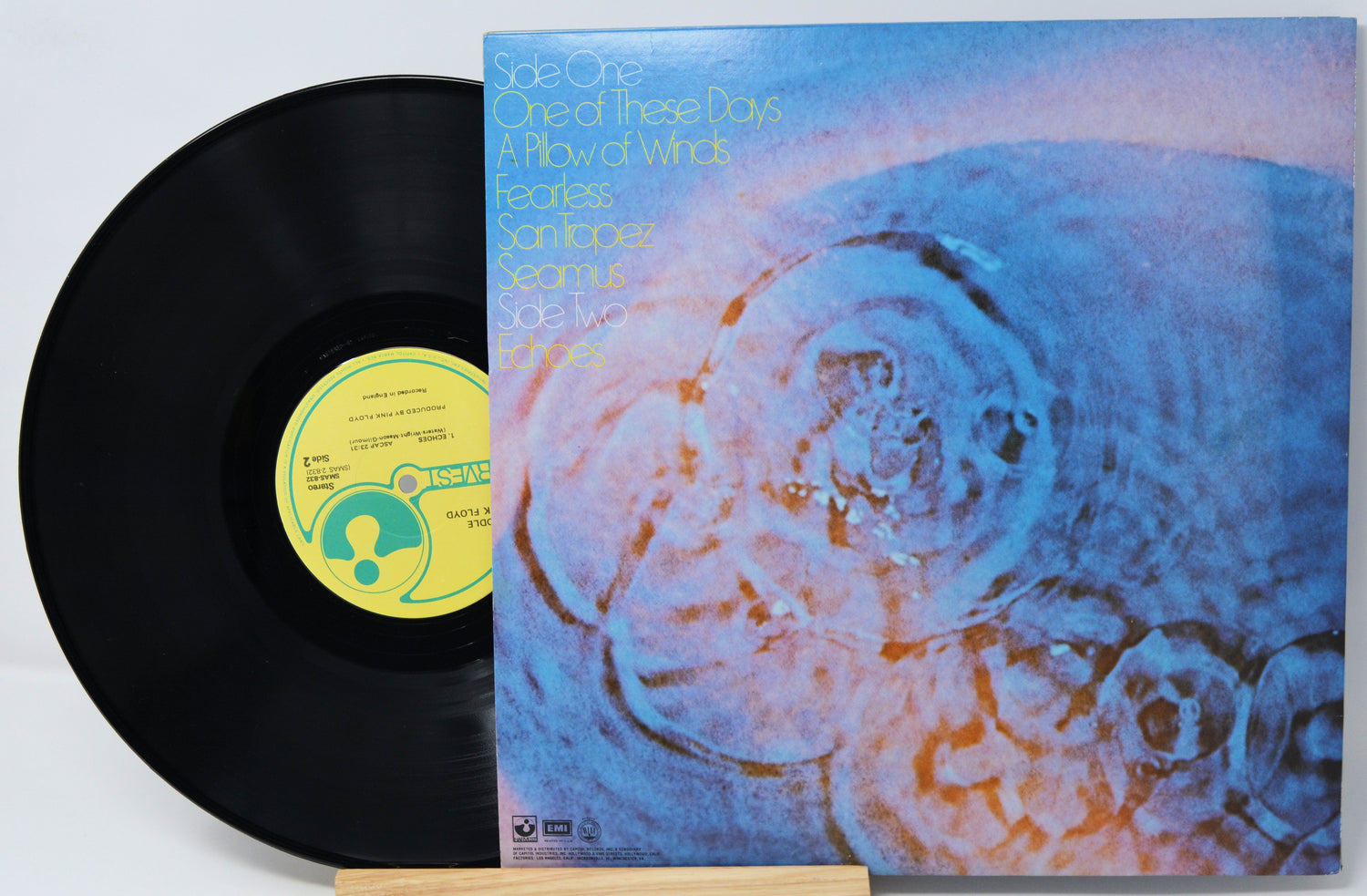 Vinyl record with a colorful cover featuring abstract designs.