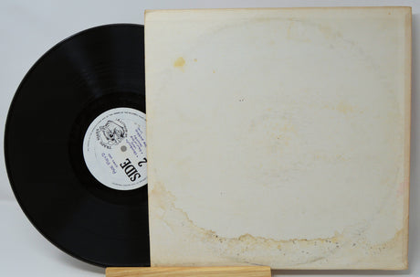 Pink Floyd Omay Yad vinyl record partially inside a plain, aged record sleeve with visible stains