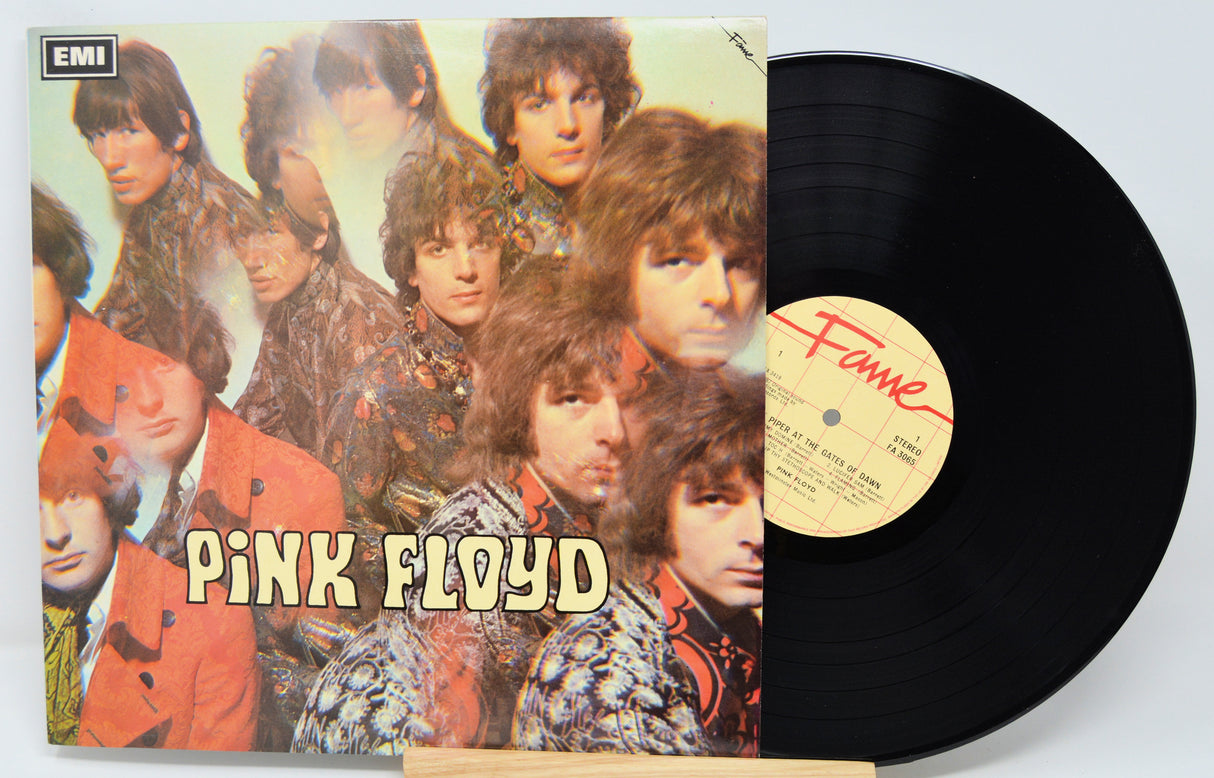 Vinyl record with Pink Floyd album cover featuring band members and EMI logo.